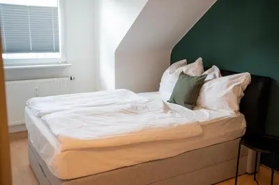 Ein Bett oder Betten in einem Zimmer der Unterkunft Traumwohnung - Charmante Citywohnung nahe Hauptbahnhof