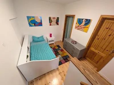 Ein Bett oder Betten in einem Zimmer der Unterkunft Doppelhaushälfte Scheunenzauber