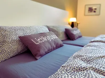 Ein Bett oder Betten in einem Zimmer der Unterkunft Kamoro