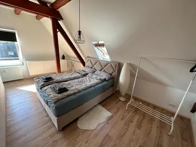 Ein Bett oder Betten in einem Zimmer der Unterkunft Schöne große Maisonettenwohnung in Weißenthurm