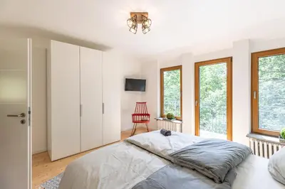 Ein Bett oder Betten in einem Zimmer der Unterkunft Landhaus Karbach mit Gartensauna und Hot Tub, eingezäunter Garten, 4-10 Personen