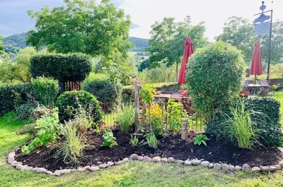 Ein Garten an der Unterkunft Echternacher Hof - Moselloft