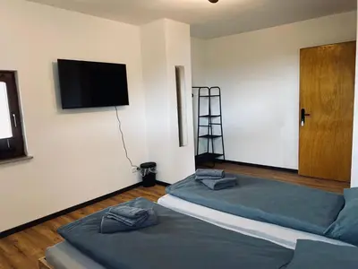 Ein Bett oder Betten in einem Zimmer der Unterkunft Ringtoys Rooms mit einem Gemeinschaftsbad One bathroom to share with four rooms