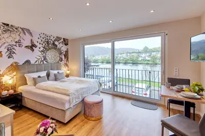 Ein Bett oder Betten in einem Zimmer der Unterkunft Luxus Apartments Mosel-Zeit NEU 2023