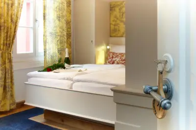 Ein Bett oder Betten in einem Zimmer der Unterkunft Rhein Hotel Bacharach und Stübers Restaurant