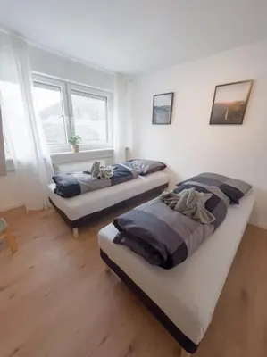 Ein Bett oder Betten in einem Zimmer der Unterkunft 3-Zimmer Apartment 88 qm bis zu 8 Personen