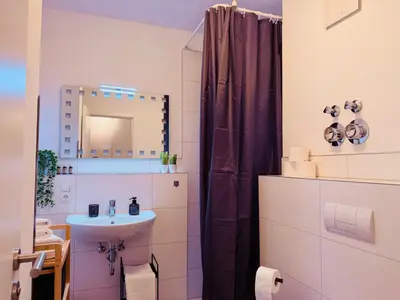 Ein Badezimmer in der Unterkunft Klassen Stay - Exklusive Apartments am HBF - Küche, Netflix
