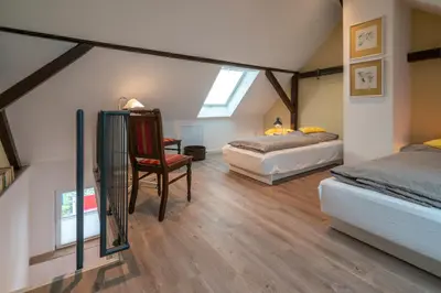 Ein Bett oder Betten in einem Zimmer der Unterkunft Franze´s Haus - mit Rhein- & Burgenblick