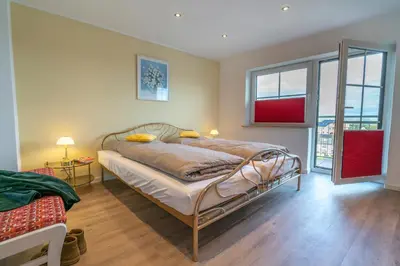 Ein Bett oder Betten in einem Zimmer der Unterkunft Franze´s Haus - mit Rhein- & Burgenblick