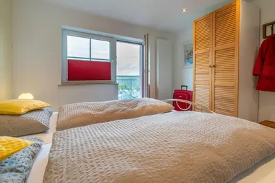 Ein Bett oder Betten in einem Zimmer der Unterkunft Franze´s Haus - mit Rhein- & Burgenblick