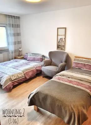 Ein Bett oder Betten in einem Zimmer der Unterkunft Monteur- und Gästehaus am Brückchen mit All Inklusive Nutzung