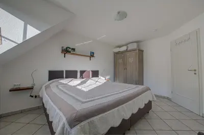 Ein Bett oder Betten in einem Zimmer der Unterkunft Ferienwohnung Panorama Moselblick