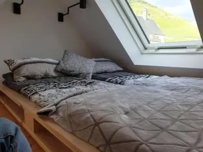 Ein Bett oder Betten in einem Zimmer der Unterkunft Romantisches Studio 4 Rosenburgblick in Moselnähe