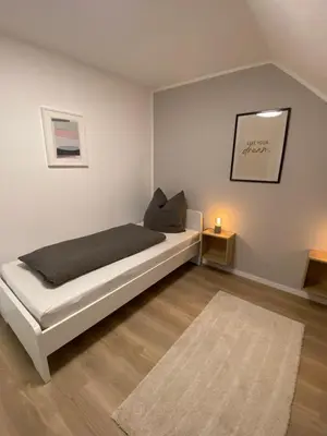 Ein Bett oder Betten in einem Zimmer der Unterkunft Ferienwohnung Loreley Mittelrheintal