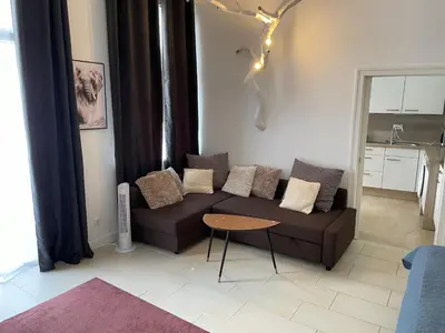 Ein Sitzbereich in der Unterkunft Schönes Apartment Mitten in der Stadt III