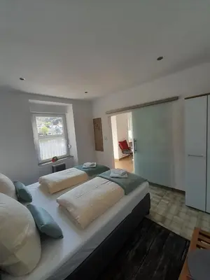 Ein Bett oder Betten in einem Zimmer der Unterkunft Moselliebe Zell