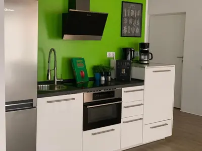 Küche/Küchenzeile in der Unterkunft Eifel24, neues und barrierefreies Appartement mit Terrasse