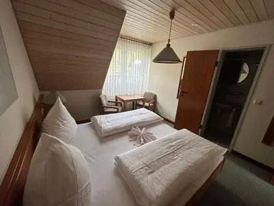 Ein Bett oder Betten in einem Zimmer der Unterkunft Mike‘s Mosel Lodge