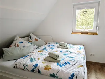 Ein Bett oder Betten in einem Zimmer der Unterkunft Familien-Apartment SchmitTs Katz