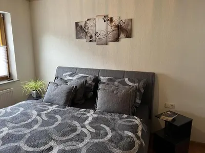 Ein Bett oder Betten in einem Zimmer der Unterkunft Ferienwohnung Moselzeit