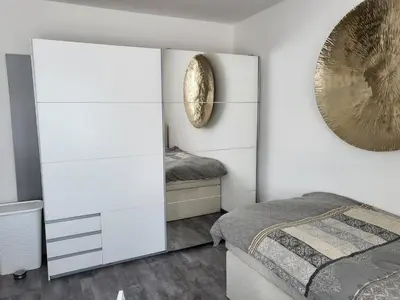 Ein Bett oder Betten in einem Zimmer der Unterkunft Lounge 3 mit 2 Schlafzimmern