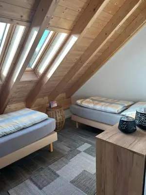 Ein Bett oder Betten in einem Zimmer der Unterkunft Ferienwohnung am Wald-und Wiesenkorb