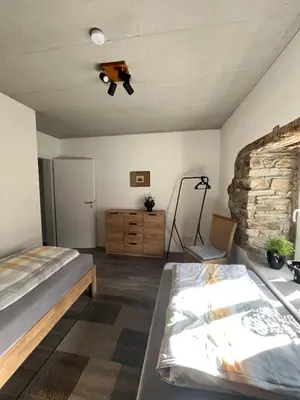 Ein Bett oder Betten in einem Zimmer der Unterkunft Ferienwohnung am Wald-und Wiesenkorb