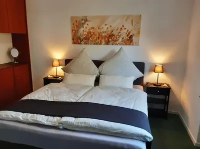 Ein Bett oder Betten in einem Zimmer der Unterkunft Ferienwohnung Mittendrin, Stadtmitte Hermeskeil