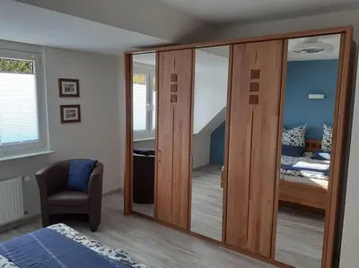 Ein Bett oder Betten in einem Zimmer der Unterkunft Ferienwohnung Ganz Oben, Stadtmitte Hermeskeil