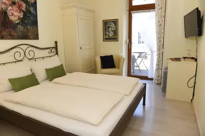 Ein Bett oder Betten in einem Zimmer der Unterkunft Altes Weingut an der Vogtei