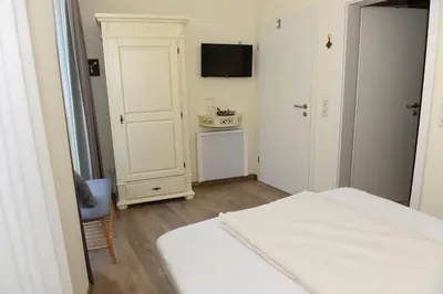 Ein Bett oder Betten in einem Zimmer der Unterkunft Altes Weingut an der Vogtei
