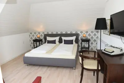 Ein Bett oder Betten in einem Zimmer der Unterkunft Altes Weingut an der Vogtei