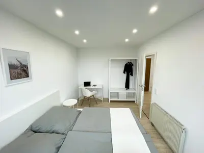 Ein Bett oder Betten in einem Zimmer der Unterkunft Ferienwohnung Schönes Maifeld