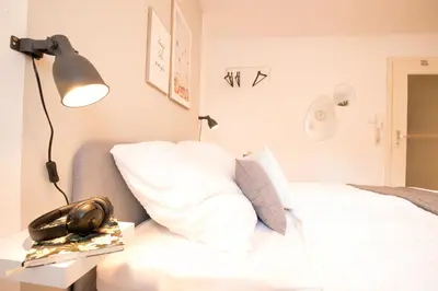 Ein Bett oder Betten in einem Zimmer der Unterkunft Modernes & zentrales Micro-Apartment