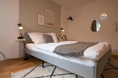 Ein Bett oder Betten in einem Zimmer der Unterkunft Modernes & zentrales Micro-Apartment