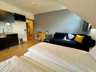 Ein Bett oder Betten in einem Zimmer der Unterkunft JUNIPRO Hotel Schinderhannes