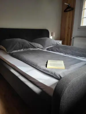 Ein Bett oder Betten in einem Zimmer der Unterkunft Ferienhaus Ehrbachklamm