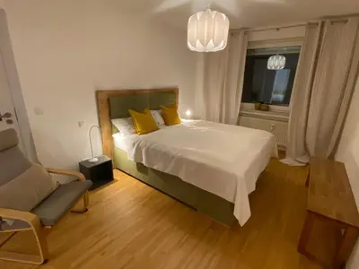 Ein Bett oder Betten in einem Zimmer der Unterkunft Schöne Wohnung 90qm mit Sonnenterrasse und Aussicht