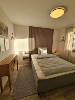Ein Bett oder Betten in einem Zimmer der Unterkunft Ferienwohnung Rosenberg
