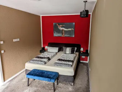 Ein Bett oder Betten in einem Zimmer der Unterkunft Ferienwohnungen Heimkino Cochem