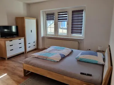 Ein Bett oder Betten in einem Zimmer der Unterkunft MacFeWo - Komplette Ferienwohnung im Stadtkern von Mayen