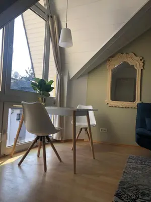 Ein Sitzbereich in der Unterkunft Römerburg Apartments Antoniusstrasse