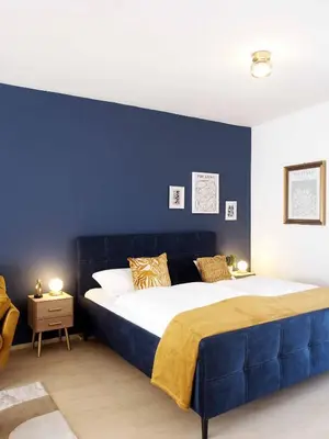 Ein Bett oder Betten in einem Zimmer der Unterkunft Römerburg Apartments Antoniusstrasse