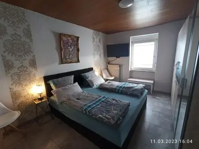 Ein Bett oder Betten in einem Zimmer der Unterkunft Ferienhaus Laila