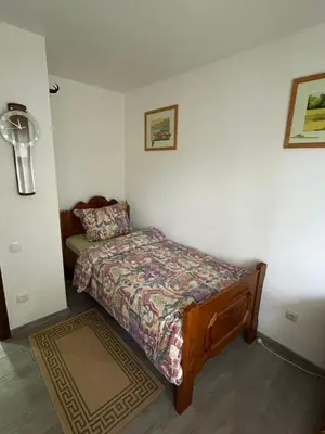 Ein Bett oder Betten in einem Zimmer der Unterkunft Ferienhaus Olaf & Olga Buchali GbR