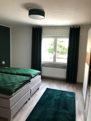 Ein Bett oder Betten in einem Zimmer der Unterkunft Ferienwohnung Dunja