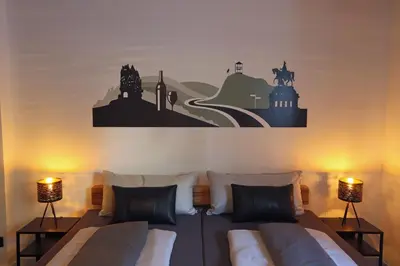 Ein Bett oder Betten in einem Zimmer der Unterkunft Mosel19 - Moderne, hochwertige Ferienwohnung