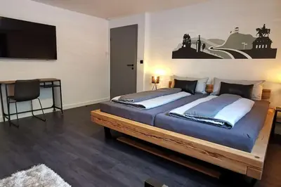 Ein Bett oder Betten in einem Zimmer der Unterkunft Mosel19 - Moderne, hochwertige Ferienwohnung