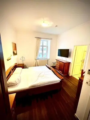 Ein Bett oder Betten in einem Zimmer der Unterkunft Hotel zur Römerbrücke