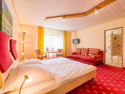 Ein Bett oder Betten in einem Zimmer der Unterkunft Park Hotel